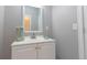 Modern bathroom with a white vanity and green accents at 16301 Hudson Rd, Hudson, CO 80642