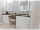 Bright bathroom featuring double sinks, vanity, and modern finishes at 16301 Hudson Rd, Hudson, CO 80642