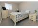Bedroom with neutral tones, dresser and nightstand at 16301 Hudson Rd, Hudson, CO 80642