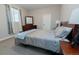 Cozy bedroom featuring a large window and dark wood furniture at 16301 Hudson Rd, Hudson, CO 80642