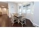 Charming dining area with bright bay window and stylish chandelier lighting at 16301 Hudson Rd, Hudson, CO 80642