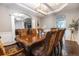 Spacious dining room showcasing an elegant table, designer chairs, and a modern chandelier at 16301 Hudson Rd, Hudson, CO 80642