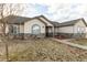 Beautiful home featuring stone accents, neutral siding, and well-kept landscaping at 16301 Hudson Rd, Hudson, CO 80642