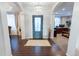 Inviting foyer with stylish tile flooring, high ceilings, and an elegant chandelier at 16301 Hudson Rd, Hudson, CO 80642