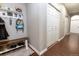 Functional hallway featuring storage, a bench, and wood-look tile flooring at 16301 Hudson Rd, Hudson, CO 80642