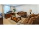 Cozy living room with plush sofas, a large window, and a charming coffee table at 16301 Hudson Rd, Hudson, CO 80642