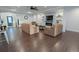 Elegant living room with tile flooring, a decorative fireplace, and comfortable seating arrangements at 16301 Hudson Rd, Hudson, CO 80642