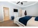 Spacious bedroom features a TV, carpet flooring, and two closets at 16301 Hudson Rd, Hudson, CO 80642