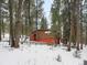 Cozy cabin nestled among towering pines and snow, offering privacy and seclusion at 5525 S Twin Spruce Dr, Evergreen, CO 80439