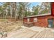 Backyard includes a wooden deck, concrete patio, and a hot tub at 1150 Fremont Dr, Larkspur, CO 80118