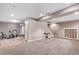 This finished basement has neutral paint and carpet, recessed lighting, and exercise equipment in the next room at 1150 Fremont Dr, Larkspur, CO 80118
