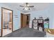 Bedroom features include ceiling fan, carpet, and adjacent laundry and bathroom at 1150 Fremont Dr, Larkspur, CO 80118