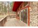 The deck features a stone pillar and sliding glass doors at 1150 Fremont Dr, Larkspur, CO 80118
