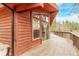 This property includes a deck and a beautiful view of the surrounding treeline at 1150 Fremont Dr, Larkspur, CO 80118