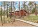 Charming exterior view of the property with mature trees at 1150 Fremont Dr, Larkspur, CO 80118