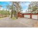 Attached two-car garage adjacent to a basketball court and large driveway at 1150 Fremont Dr, Larkspur, CO 80118