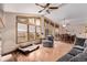 Bright living room with vaulted ceilings, large windows, hardwood floors, and comfortable seating at 1150 Fremont Dr, Larkspur, CO 80118