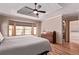 This main bedroom features a walk in closet, exterior view, hard wood floors, and modern décor at 1150 Fremont Dr, Larkspur, CO 80118