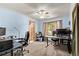 This office features a ceiling fan, a window, and two desks with rolling chairs at 1150 Fremont Dr, Larkspur, CO 80118
