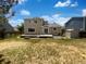Expansive backyard with a wooden deck, lush grass, and a shed perfect for outdoor activities at 12550 Eastlake Dr, Thornton, CO 80241
