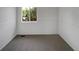A room with carpet flooring, white walls and trim, and a window that offers an outside view at 12550 Eastlake Dr, Thornton, CO 80241