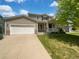 Charming two-story home with a well-manicured lawn, attached garage, and inviting front porch at 12550 Eastlake Dr, Thornton, CO 80241