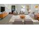 Bright living room with neutral paint, stylish furnishings, and a plush rug creating a cozy atmosphere at 12550 Eastlake Dr, Thornton, CO 80241