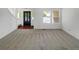 Bright living room with neutral paint, carpet, and lots of natural light at 12550 Eastlake Dr, Thornton, CO 80241