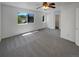 The main bedroom features neutral carpet, bright light, and an expansive window view at 12550 Eastlake Dr, Thornton, CO 80241