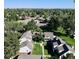 Aerial view of home showcasing neighborhood, mature landscaping and grassy yards at 230 S 22Nd Ave, Brighton, CO 80601