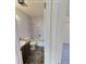 Bright bathroom with a shower-tub combination and neutral tile at 230 S 22Nd Ave, Brighton, CO 80601