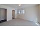 Bright bedroom with neutral walls, carpet floors, and double window at 230 S 22Nd Ave, Brighton, CO 80601