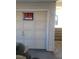 Garage door featuring 'For Sale' sign, house number, and entry way at 230 S 22Nd Ave, Brighton, CO 80601