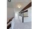 Hallway on the second floor, featuring hardwood trim, modern lighting, and fresh paint at 230 S 22Nd Ave, Brighton, CO 80601