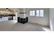 A cozy living room with a fireplace and views to the kitchen and backyard at 230 S 22Nd Ave, Brighton, CO 80601