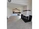 Spacious living room featuring a fireplace and an open floor plan that flows into the kitchen at 230 S 22Nd Ave, Brighton, CO 80601