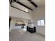 Spacious living room featuring a fireplace and an open floor plan that flows into the kitchen at 230 S 22Nd Ave, Brighton, CO 80601