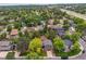 Aerial view of a neighborhood with mature trees and well-maintained houses at 8268 W Caley Pl, Littleton, CO 80123