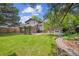 Large backyard with mature trees and expansive lawn at 8268 W Caley Pl, Littleton, CO 80123