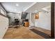 Basement with white brick accent wall, great for a gym or office space at 8268 W Caley Pl, Littleton, CO 80123
