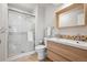 Updated bathroom showcases a new tile shower and stylish vanity at 8268 W Caley Pl, Littleton, CO 80123