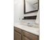 Bathroom featuring stylish vanity, updated fixtures, and modern mirror at 8268 W Caley Pl, Littleton, CO 80123