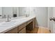 Bright bathroom with double sinks, white countertops, and a clean, modern design at 8268 W Caley Pl, Littleton, CO 80123