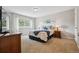 Comfortable bedroom with large windows and wood furnishings at 8268 W Caley Pl, Littleton, CO 80123