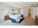 Inviting bedroom featuring neutral walls, carpeted floor, and walk in closet at 8268 W Caley Pl, Littleton, CO 80123