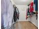 Large walk-in closet showcasing organized storage and carpeted floors at 8268 W Caley Pl, Littleton, CO 80123