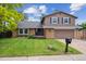 Charming two-story home with a well-manicured lawn and classic design at 8268 W Caley Pl, Littleton, CO 80123
