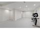 Spacious finished basement with neutral colors, recessed lighting, and an exercise bike at 1774 Spring Water Pl, Highlands Ranch, CO 80129