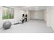 Finished basement with exercise equipment and natural light from window at 1774 Spring Water Pl, Highlands Ranch, CO 80129