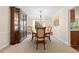 Formal dining room with a chandelier, large window, and classic furnishings at 1774 Spring Water Pl, Highlands Ranch, CO 80129